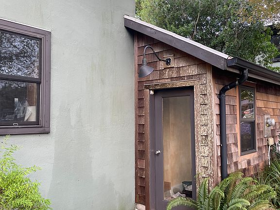 Side entrance on east side of house has a mudroom with heated floor.