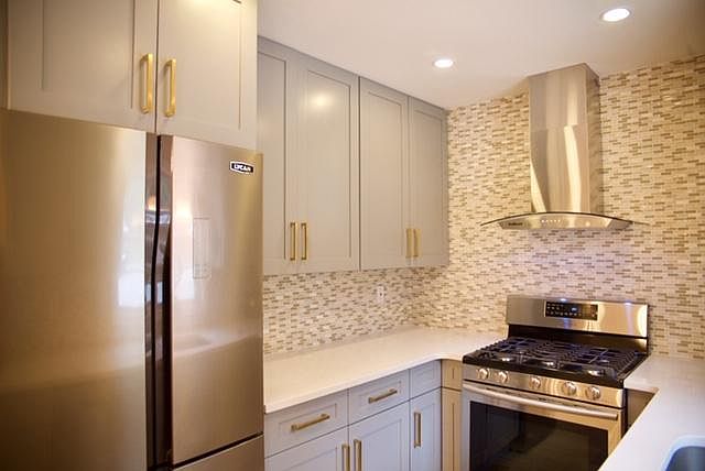 Sunny, designer planned kitchen, Quartz countertops, new cab