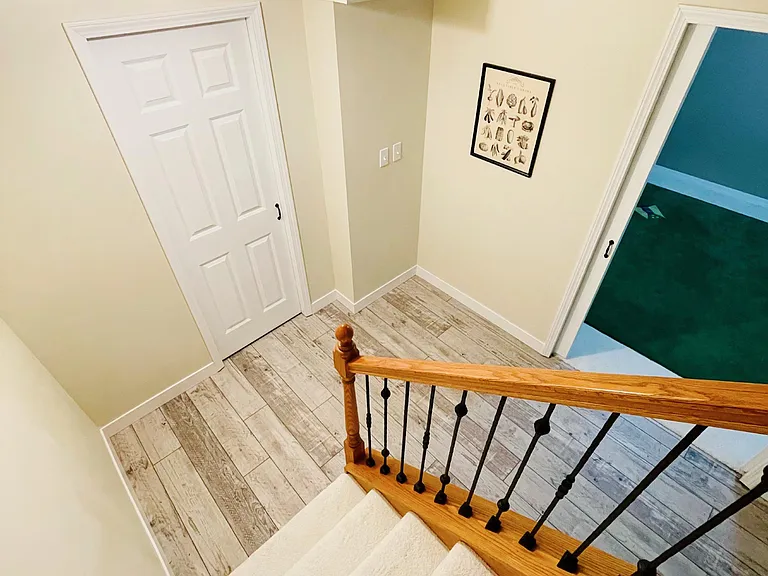 Basement storage room (white door) + Big room (for excise/office/storage)