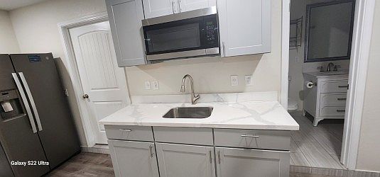 Alternate view of kitchenette. The jacuzzi bathroom can be seen.