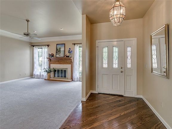 The entry also has hardwood floors and is a lovely way to greet your guests.