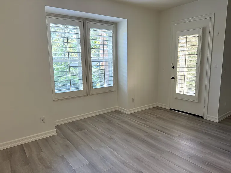 Open-concept living space with private entrance and abundant natural light.