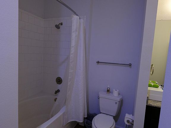 Bathroom with 2 doors- one connecting to bedroom ensuite and other to hallway