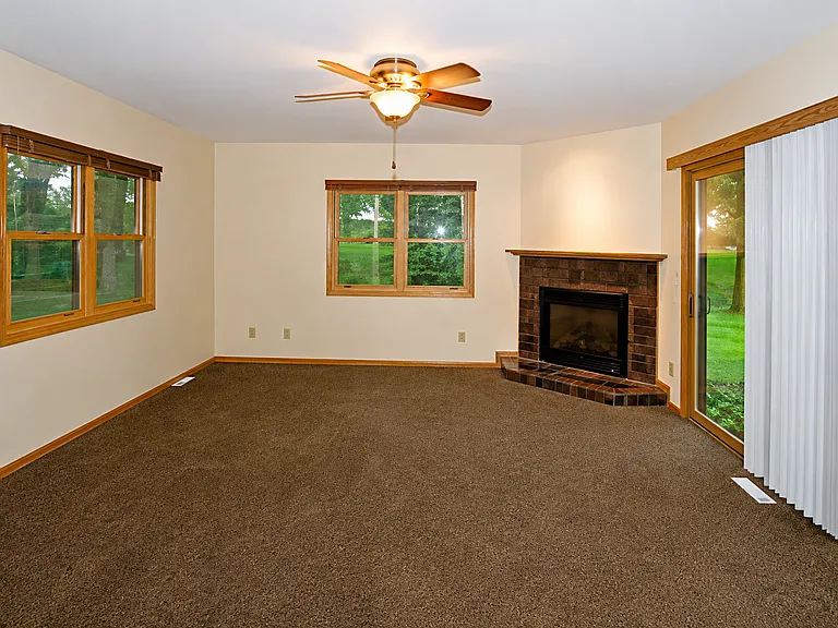 main level family room with sliding barn door to close off from kitchen/mud room. Access to back patio.