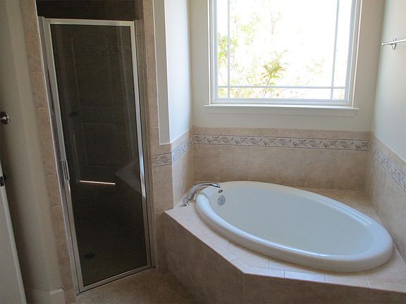 Master Bath has tub and walk-in shower.