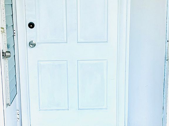 Screened door into Front Entrance