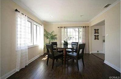 Bright & airy dining room w/ brand new flooring