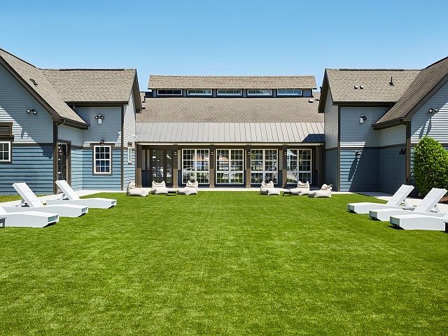 Relax and Soak Up the Sun in Our Grassy Outdoor Lounge at The Flatts Salisbury.