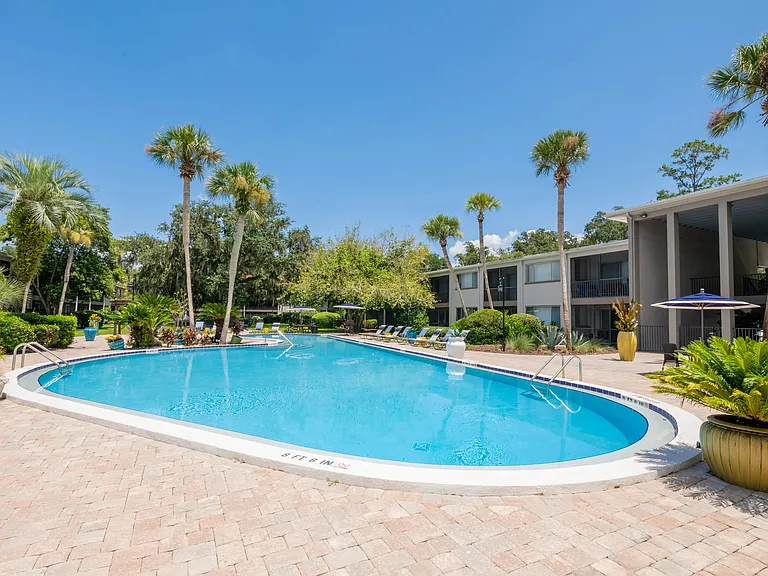 Step into a perpetual sanctuary of sunshine, where poolside loungers offer year-round vacation ambiance by the water's edge.