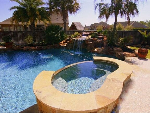 Relax and Unwind in your own spa with overflow waterfall into main pool and remote control programmi