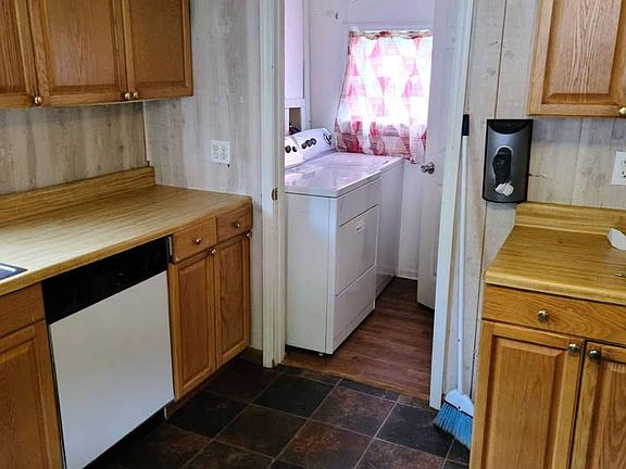 Kitchen showing laundry room