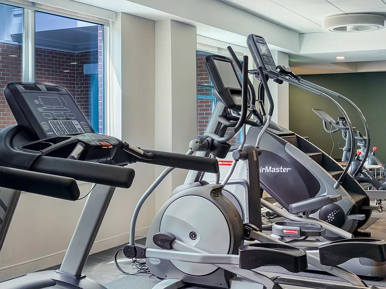 Cardio options include treadmills, ellipticals, StairMaster, row machine, and bikes