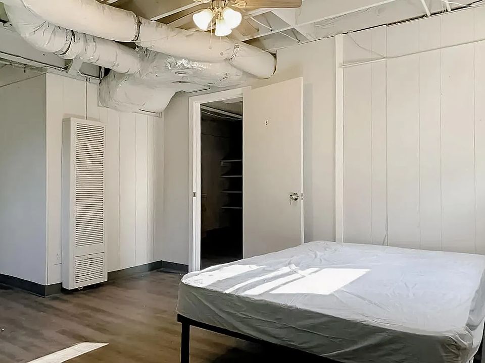 Oversized room with dual windows and a ceiling fan!