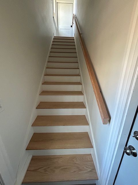 Side entrance stairwell to the apartment. Garage entrance at the bottom of the stairs