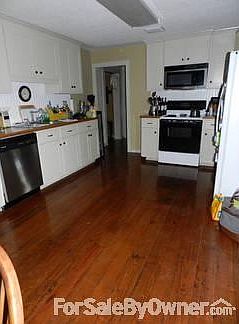 All wood cabinets & beaded board backsplash. Appliances included in sale