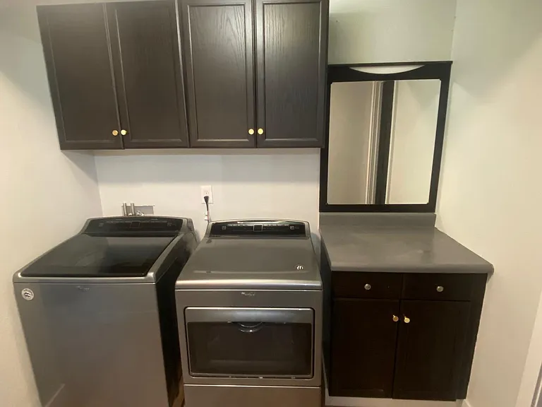 full laundry space with updated washer and dryer