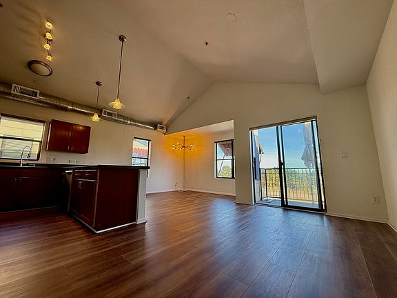 Brand new floors installed in October '25! Open floor plan with spacious high ceilings.
