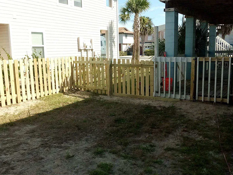 View of the fence enclosure on the right side looking at the porch