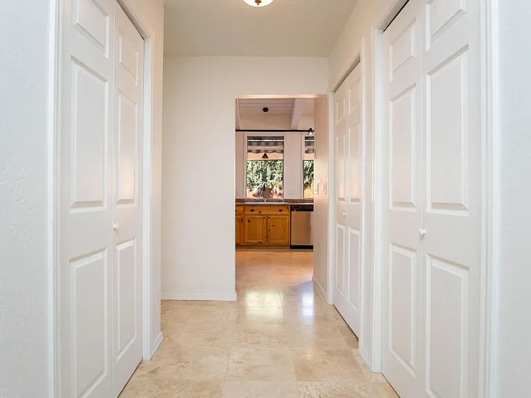 Numerous closets and pantry space leading to kitchen.