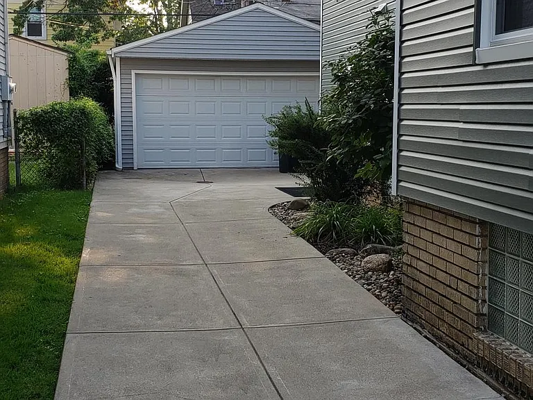 Driveway to garage. Automatic garage door opener for your convenience.