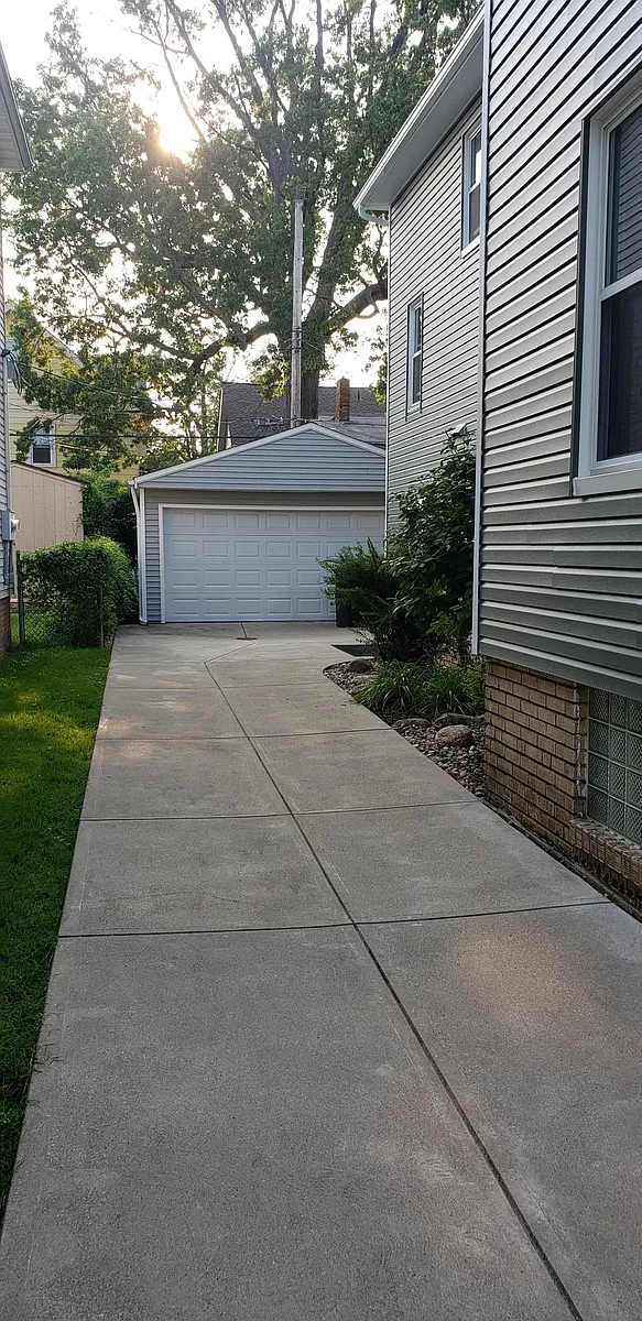 Driveway to garage. Automatic garage door opener for your convenience. - 2212 Eldred Ave