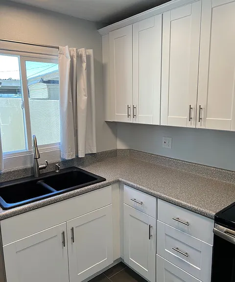 Kitchen, Kitchen Lighting, Granite Sink, Cabinets, Appliances, Tile and Grout Flooring, Newly Painted Ceiling, Walls, Baseboard and Molding.
