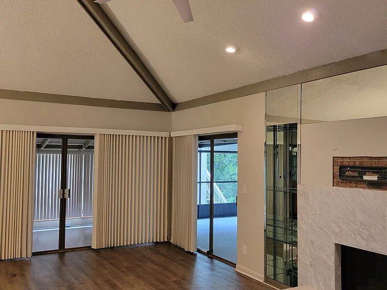 Sliders leading to Florida room under air and spacious screen porch, overlooking the pool.