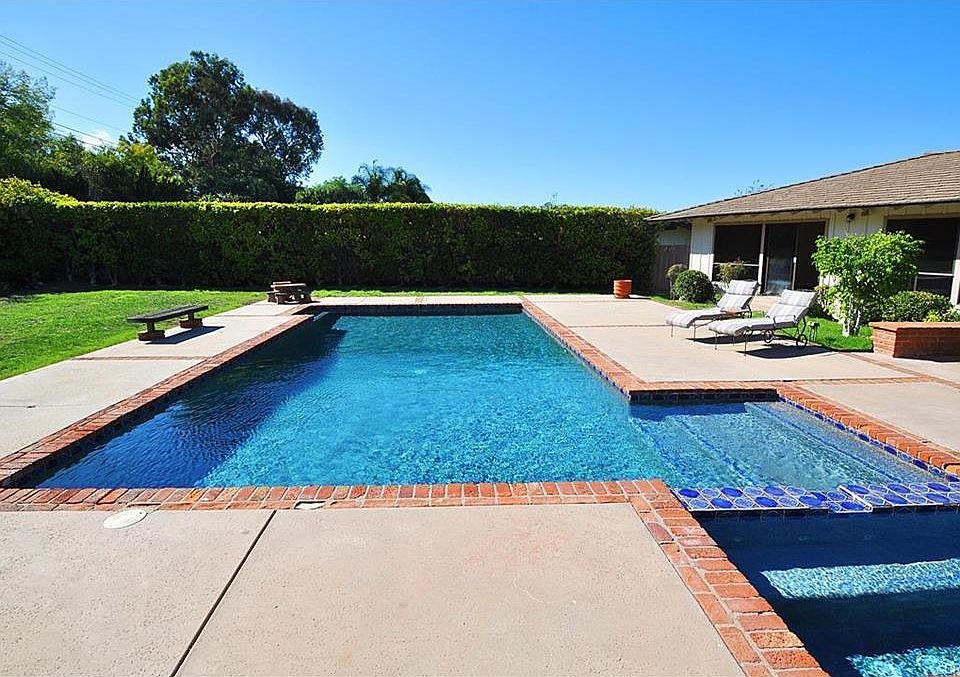Beautiful flat yard with small pool house with 1/2 bath