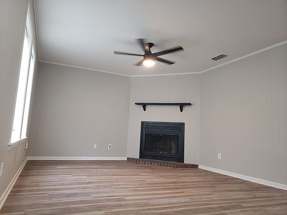 Living room with fireplace and remote controlled fan