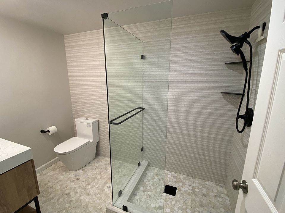 New bathroom with natural stone and porcelain creates a serene, spa-like atmosphere