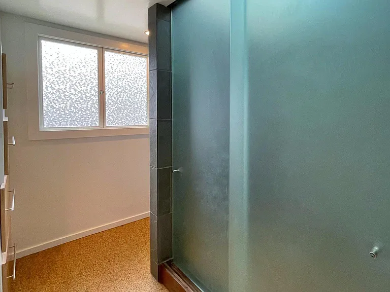 spa-like double shower with frosted glass and skylight