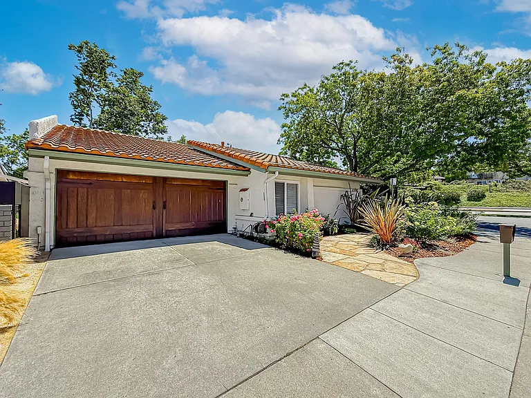 Custom natural wood garage door. View from front street