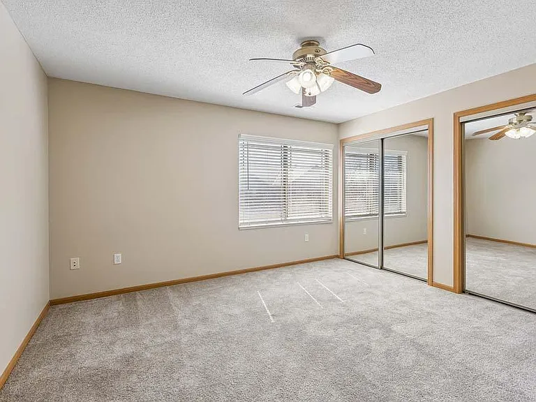 Soft natural light and cozy finishes make this bedroom feel like a peaceful retreat at the end of the day.