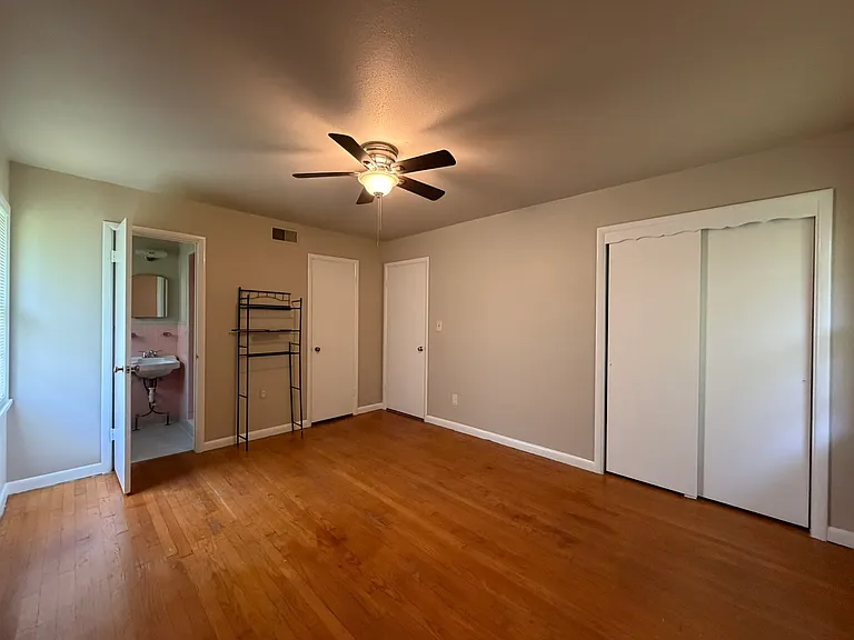Primary Bedroom with wall closet and step in closet. Opens to full Bathroom
