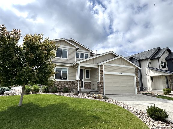Mature landscape with sprinklers front and back for easy maintenance.