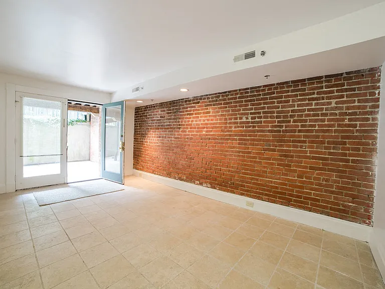 Living Area with Exposed Brick