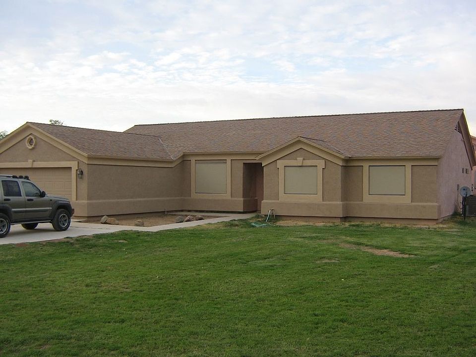 Front of house before curbing and trees