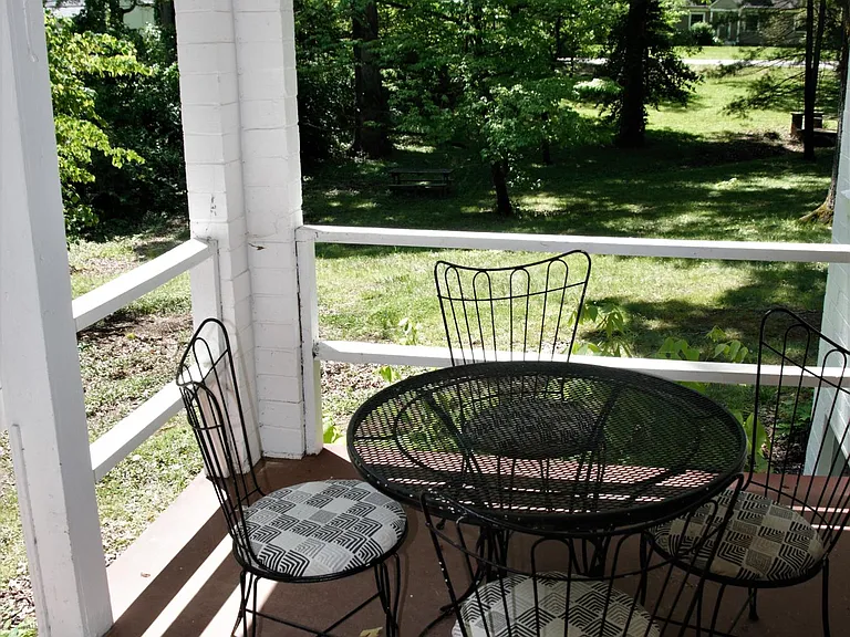 View of woods and yard from side porch