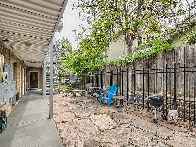 The condo is in a 3-story building in the heart of the Congress Park neighborhood! Enjoy the shared outdoor courtyard featuring various seating and a grill.