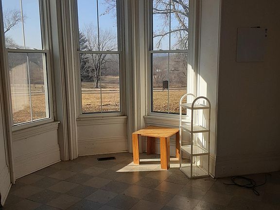 Bay window room great for reading or an office. Overlooks the large front yard set back from the street.