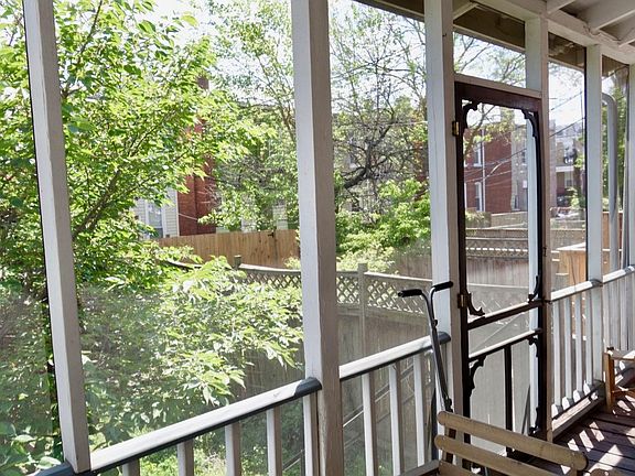 Screened back porch runs the full length of the house - perfect for dining al fresco, lounging, or working remotely