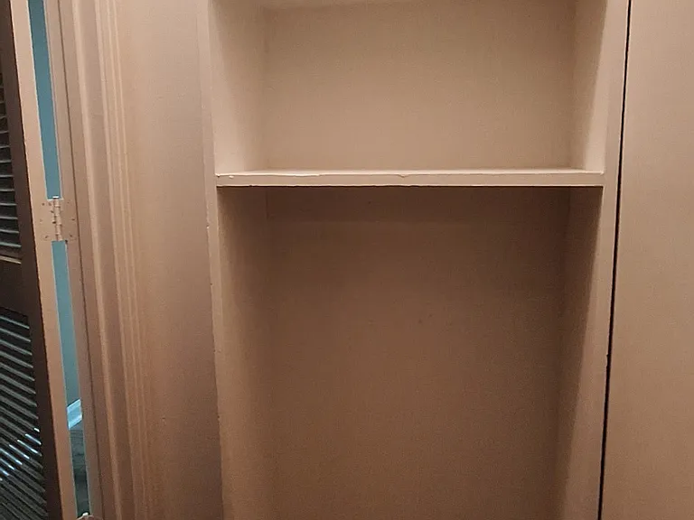 closet under stairs case. Also water heater located.