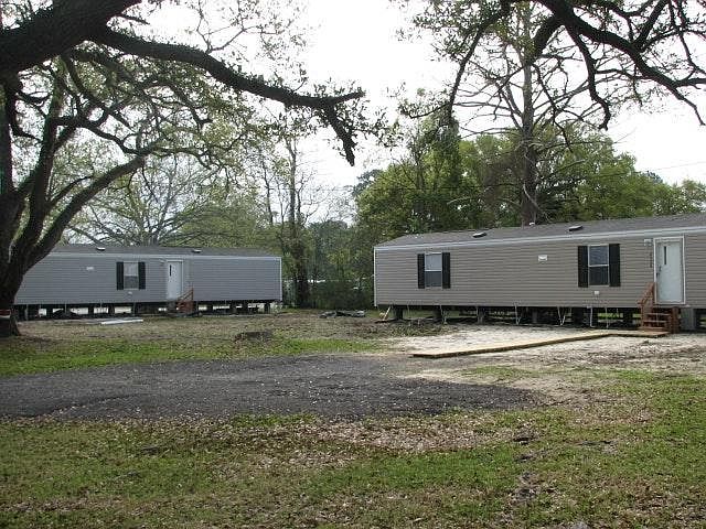 Grey Trailer on Left
