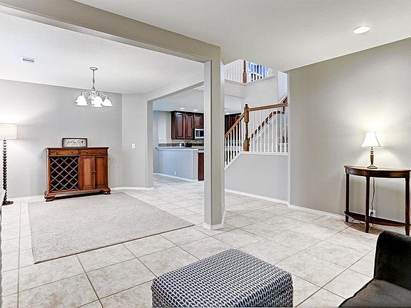 Large formal dining area for family gatherings.