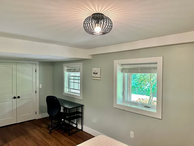 Largest bedroom downstairs with room for office space.