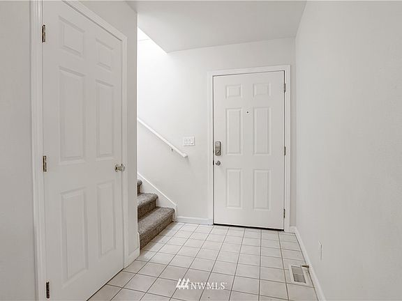 Timeless entry way with the coat closet that provides additional storage!