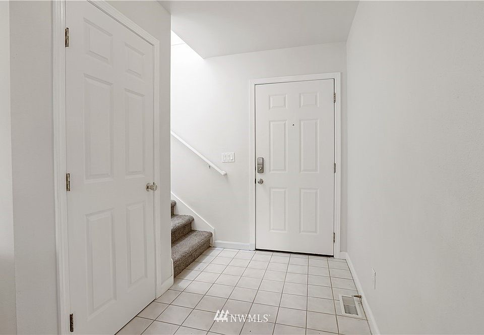 Timeless entry way with the coat closet that provides additional storage!