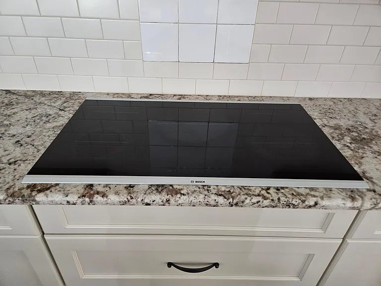 Bosch electric cooktop with auto chef mode.