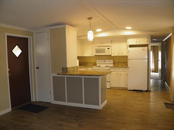 Open Floor plan. Kitchen opens to living room. Kitchen also has cozy area for small dining table to seat 2-3.