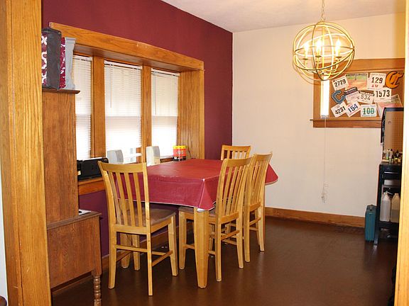 Dining room with wood floors and new lighting